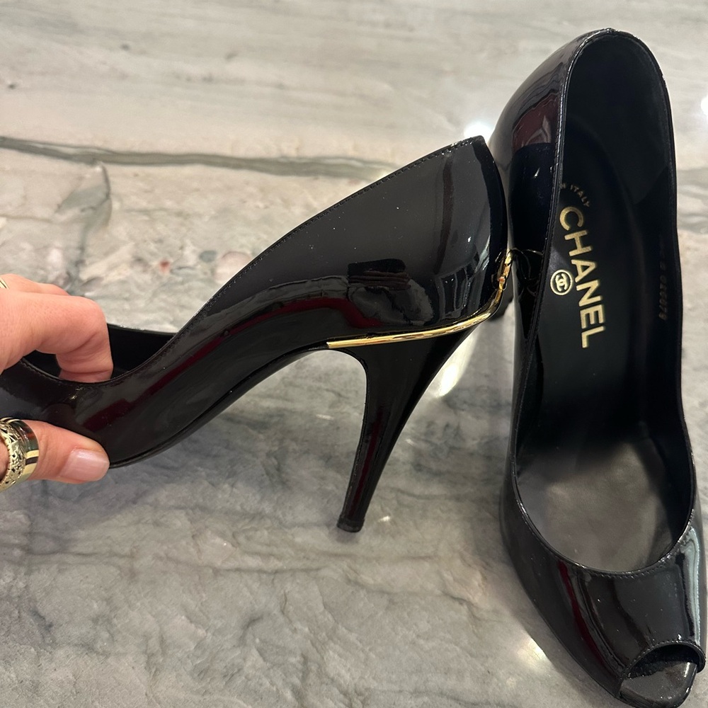 CHANEL Glossy Black Heels with Gold Accent